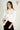 Magasinez la blouse courte en satin de Colori - Shop the short satin blouse from Colori