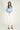 Magasinez la blouse courte en satin de Colori - Shop the short satin blouse from Colori