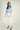 Magasinez la blouse courte en satin de Colori - Shop the short satin blouse from Colori