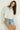 Magasinez la blouse courte à manches longues de Colori - Shop the short blouse with long sleeves from Colori