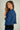 cardigan-court-beige-a-manches-trois-quarts-Colori-short-beige-cardigan-with-three-quarter-sleeves-Colori-pose