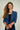 cardigan-court-beige-a-manches-trois-quarts-Colori-short-beige-cardigan-with-three-quarter-sleeves-Colori-pose