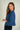 cardigan-court-beige-a-manches-trois-quarts-Colori-short-beige-cardigan-with-three-quarter-sleeves-Colori-pose
