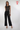 Magasinez la combinaison à haut brillant de Colori - Shop the shiny top jumpsuit from Colori