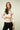 Magasinez le haut pour femme fleuri à manches trois-quarts de Colori - Shop the floral top with three-quarter sleeves from Colori