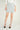 Magasinez la jupe courte à texture bouclée de Colori - Shop the short skirt with bouclé texture from Colori