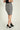 Magasinez la jupe courte en tissu bouclé de Colori - Shop the bouclé fabric short skirt from Colori