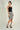 Magasinez la jupe courte en tissu bouclé de Colori - Shop the bouclé fabric short skirt from Colori