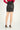 Magasinez la jupe courte en faux cuir de Colori - Shop the faux leather short skirt  from Colori