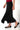 Magasinez la jupe midi asymétrique de Colori - Shop the symmetrical midi skirt from Colori