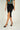 Magasinez la jupe portefeuille mi-longue de Colori - Shop the mid-length wrap skirt from Colori