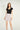 Magasinez la jupe courte à texture bouclée de Colori - Shop the short skirt with bouclé texture from Colori