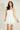 Magasinez la robe courte à volants de Colori - Shop the short ruffled dress from Colori