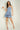 Magasinez la robe courte à volants de Colori - Shop the short ruffled dress from Colori