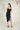 Magasinez la robe portefeuille brillante de Colori - Shop the shiny wrap dress from Colori