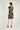 Magasinez la robe portefeuille sans manches de Colori - Shop the sleeveless wrap dress from Colori