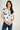 Magasinez la blouse en satin à manches courtes de Colori - Shop the short sleeve satin blouse from Colori