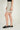 Magasinez la jupe courte à texture bouclée de Colori - Shop the short skirt with bouclé texture from Colori
