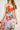 Magasinez la robe asymétrique fleurie de Colori - Shop the floral asymmetric dress from Colori