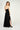 Magasinez la robe maxi brillante à col licou de chez Colori - Shop the shiny halter neck maxi dress from Colori